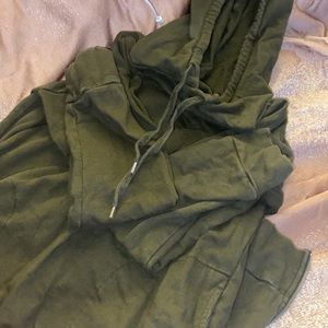 Super cute green sweater dress with zip up sides and pockets